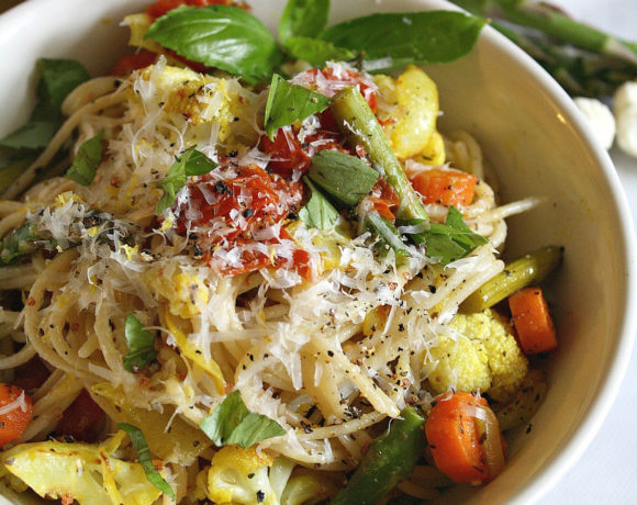 Bowl of Winter Pasta filled with gluten free noodles, cauliflower, asparagus, carrots and basil