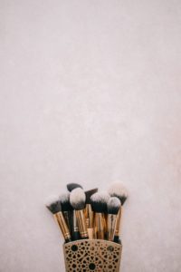 Container holding makeup brushes