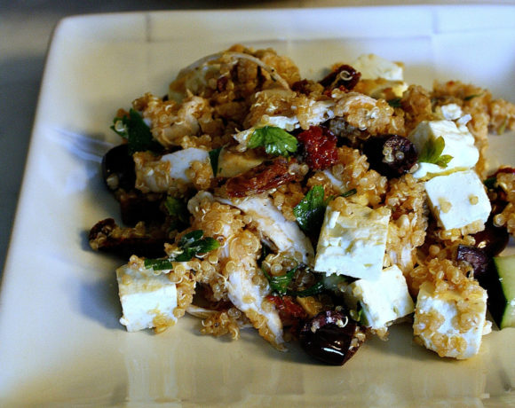 White plate with quinoa and Greek flavors
